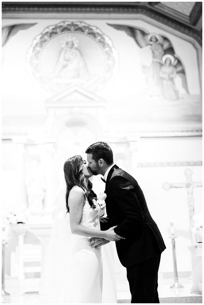 bride and groom kissing wedding day